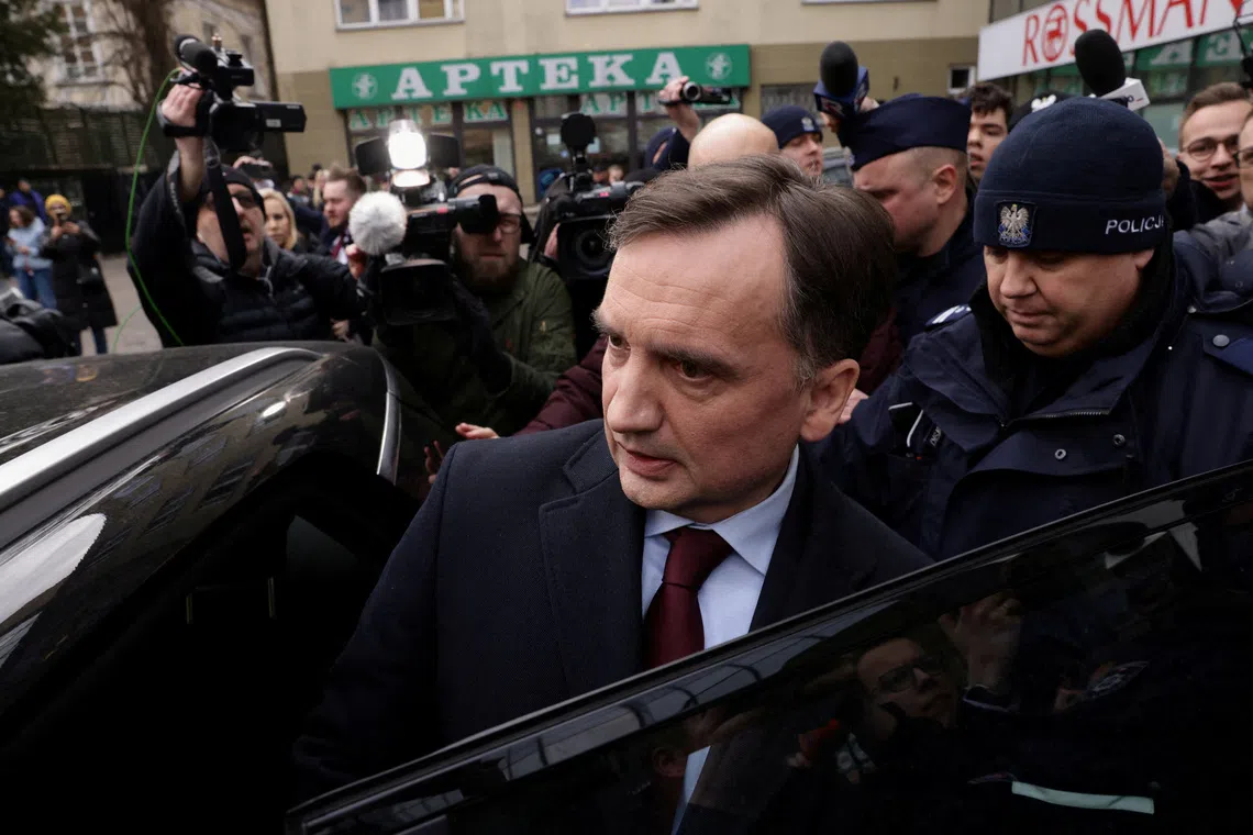 FILE PHOTO: Former Polish Justice Minister Zbigniew Ziobro enters a car after being detained by police at the Polish TV Republika station's headquarters to be brought to testify before the Pegasus Investigation Committee, in Warsaw, Poland January 31, 2025. Agencja Wyborcza.pl/Dawid Zuchowicz/via REUTERS/File Photo