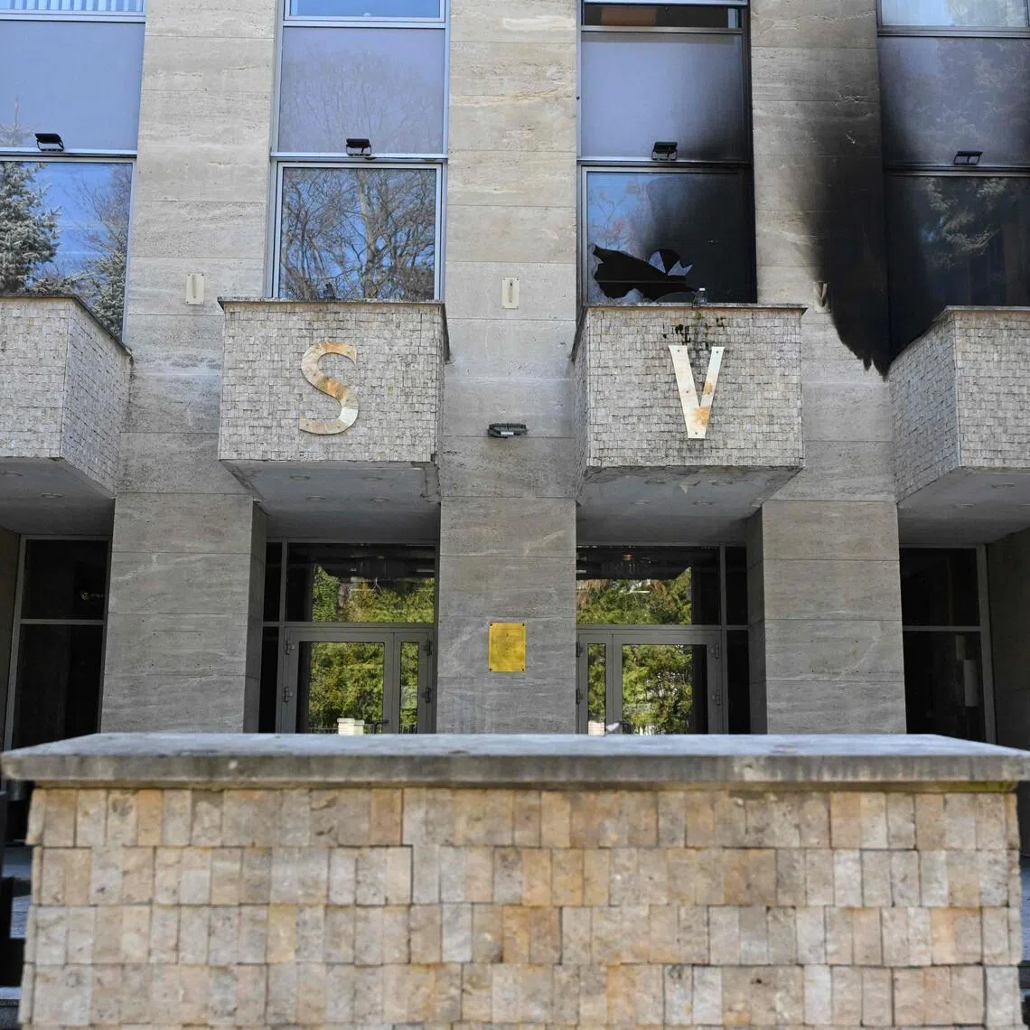 The facade of the Russian Centre for Science and Culture damaged by Molotov cocktails. 