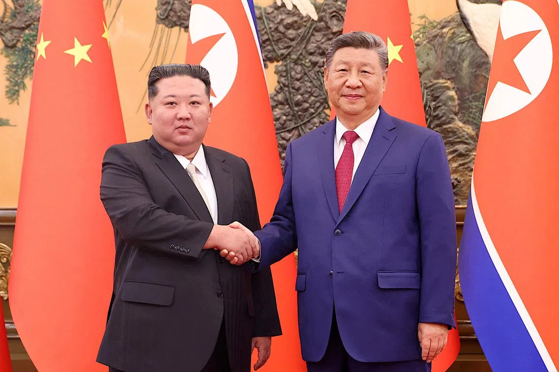Chinese President Xi Jinping and Democratic People's Republic of Korea (DPRK) leader Kim Jong Un shake hands at the Great Hall of the People in Beijing, China September 4, 2025. China Daily via REUTERS