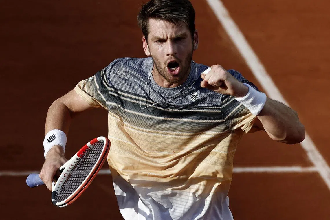 Britain's Cameron Norrie celebrates after winning his second-round match against France's Lucas Pouille.