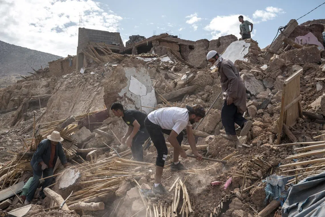 Men from Ait Abderahman’s family digging for his relatives who are still missing in the rubble of their house in Douar Tnirt village in the Atlas Mountains, in the hard-hit Al Haouz province, Morocco, on Sept 10, 2023. 
