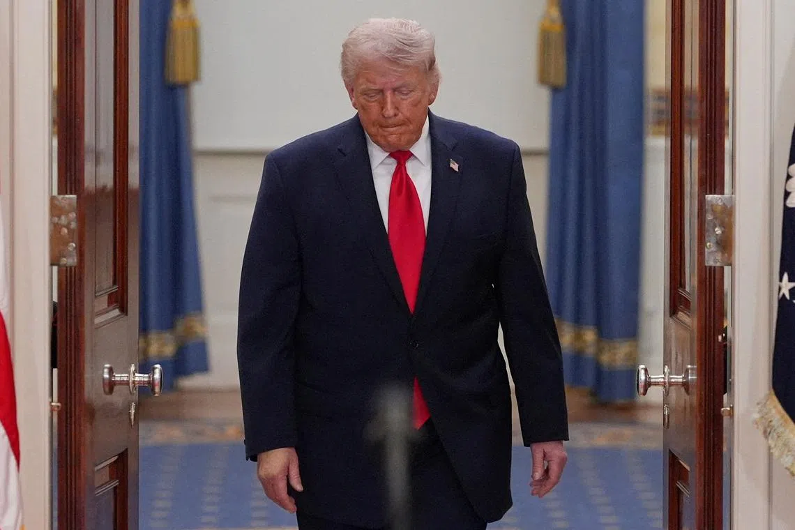 FILE PHOTO: President Donald Trump arrives to speak about the Iran war from the Cross Hall of the White House on Wednesday, April 1, 2026, in Washington.     Alex Brandon/Pool via REUTERS/File Photo
