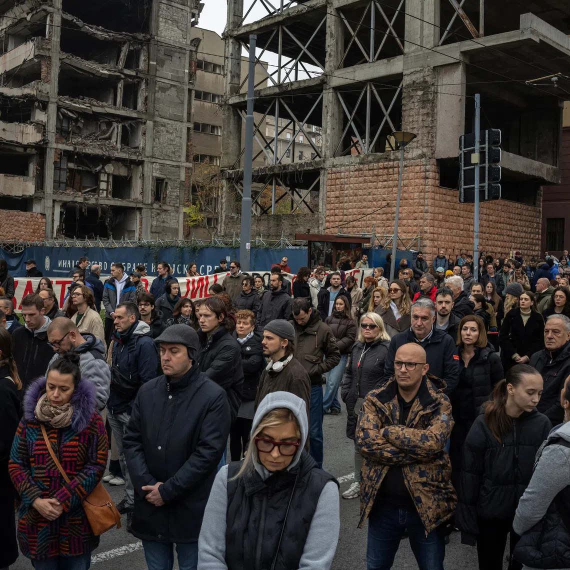 People attend a protest in front of a former army headquarters over a new law to speed its conversion into a luxury compound leased to an investment company founded by U.S. President Donald Trump's son-in-law, Jared Kushner, in Belgrade, Serbia, November 11, 2025. REUTERS/Marko Djurica