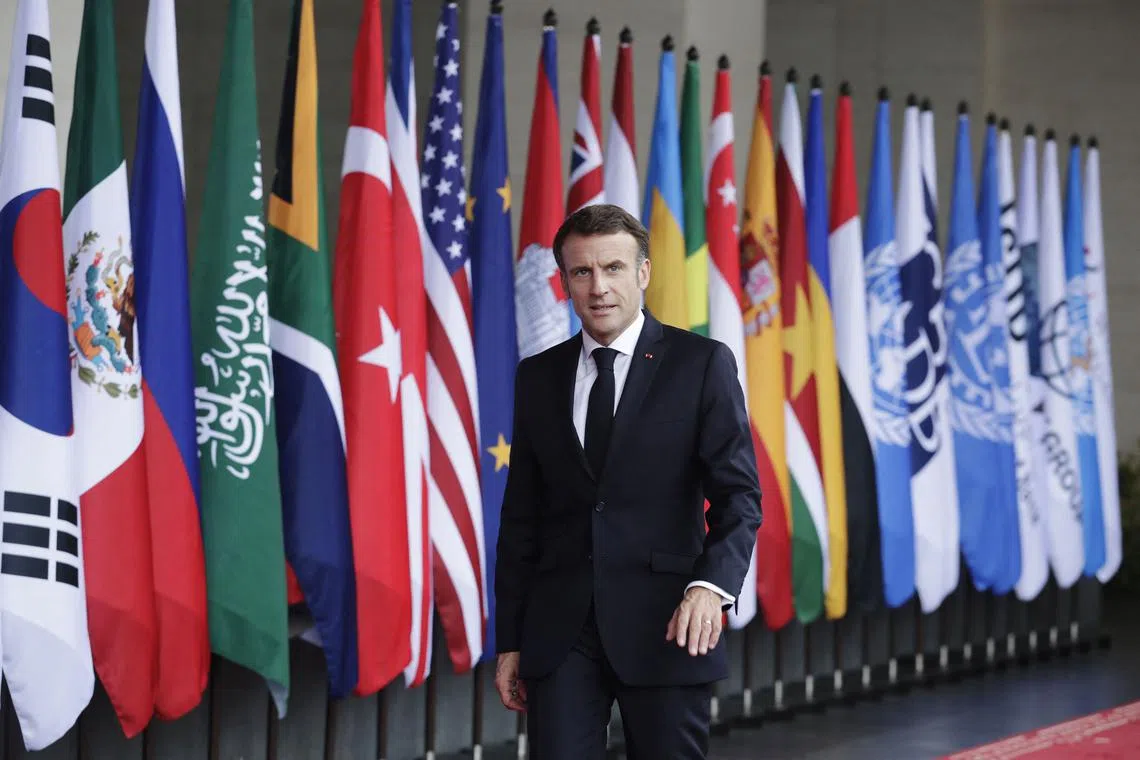 French President Emmanuel Macron (left) said it was “a very bad idea to politicise sport”.