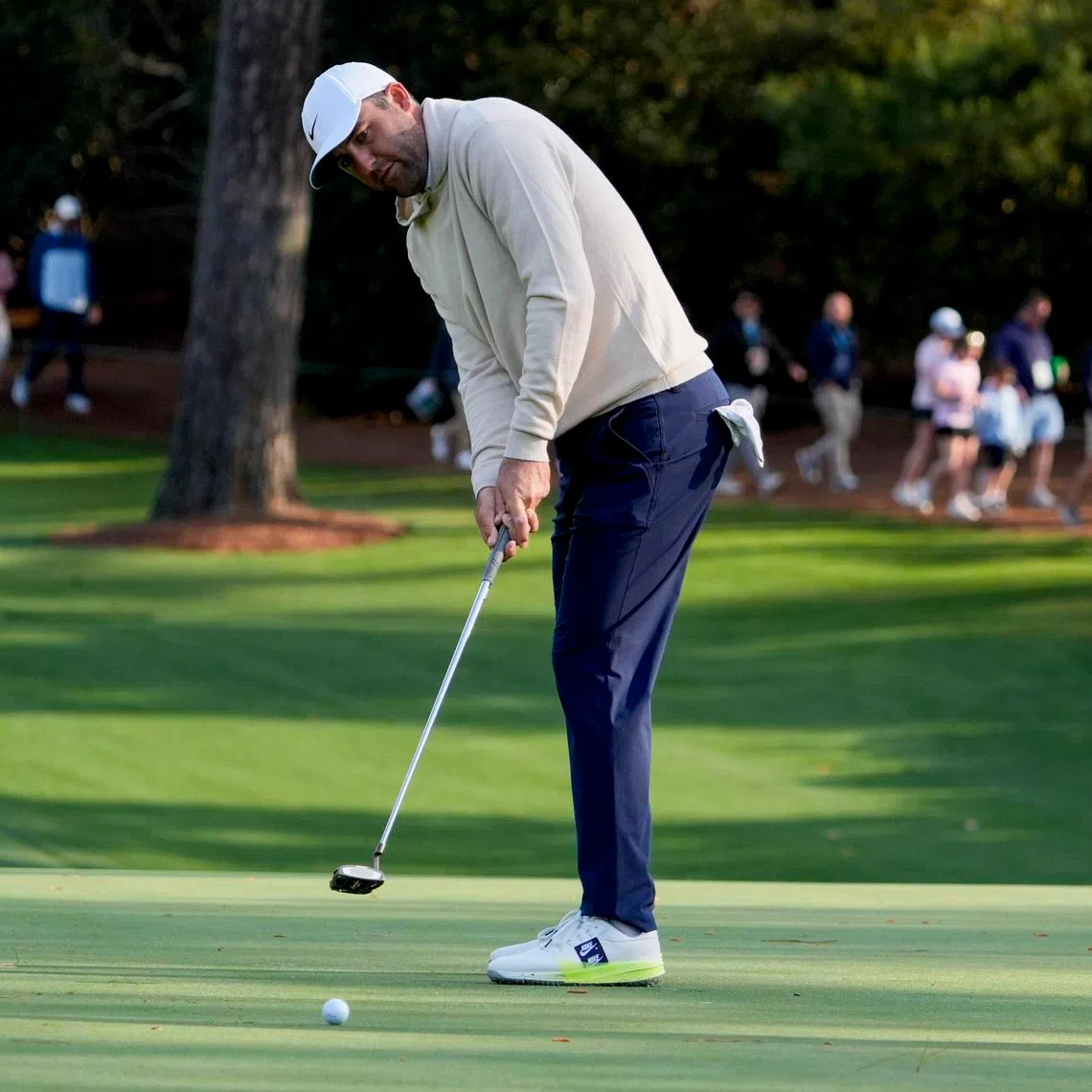 Apr 8, 2026; Augusta, Georgia, USA; Scottie Scheffler putts on the 10th green during a practice round for the Masters Tournament at Augusta National Golf Club. Mandatory Credit: Katie Goodale-Imagn Images