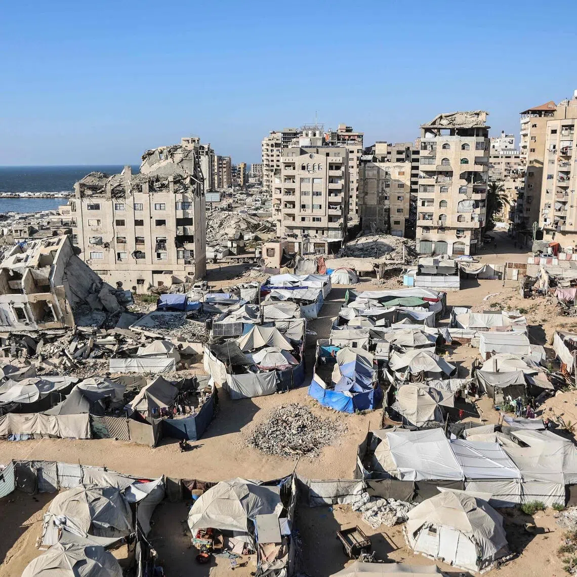 Tents shelter displaced families after the destruction of infrastructure and homes belonging to hundreds of thousands of Palestinian families in Gaza City on June 20.