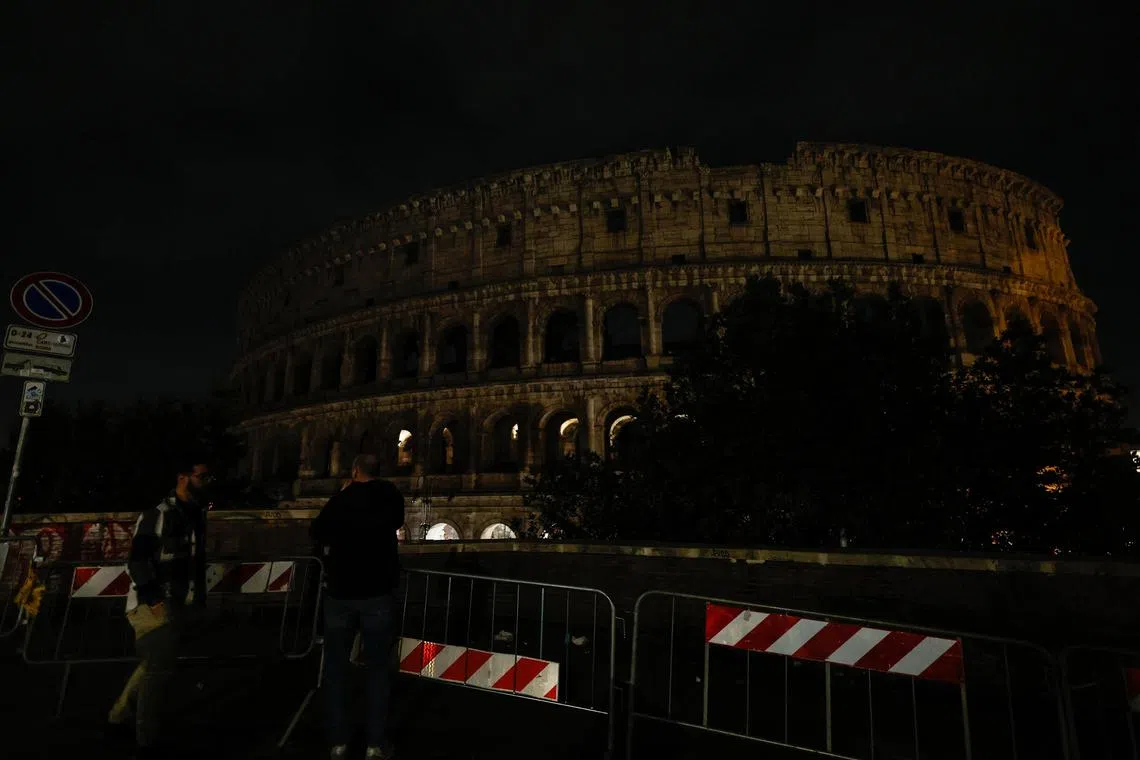 epa10543382 The Colosseum illumination is turned off as part of Earth Hour 2023 in Rome, Italy, 25 March 2023. Earth Hour is a worldwide movement organized by the World Wildlife Fund (WWF) during which non-essential lights are switched off in major cities around the globe for 60 minutes to raise awareness of energy consumption and its environmental effects and the fight against climate change. EPA-EFE/GIUSEPPE LAMI