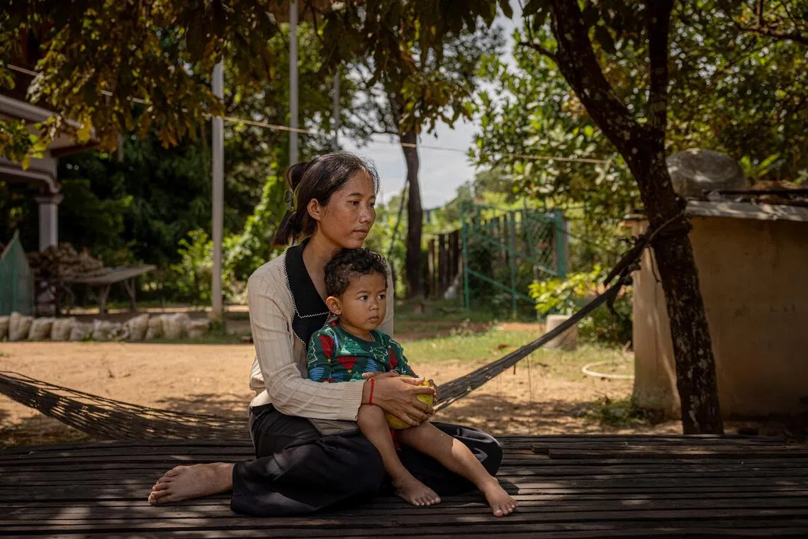 Kruoch Ya with her son Ros Soveayo in Prey Thom Village in Siem Reap, Cambodia, Oct. 22, 2025. Her husband, Hong Chanvimean, is one of the prisoners of war. In President Donald Trump, families of Cambodian troops detained by Thailand see hope and are expecting he will do for their loved ones what he did for the hostages held by Hamas: set in motion a plan that leads to their release. (Lauren DeCicca/The New York Times)
