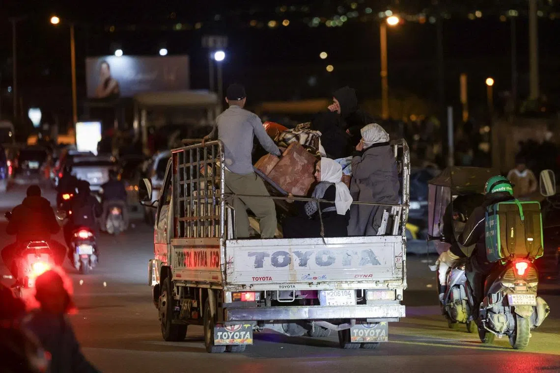 People with belongings ride on a vehicle, after the Israeli army's warning prompted residents to evacuate Beirut's southern suburbs, following an escalation between Hezbollah and Israel amid the U.S.-Israeli conflict with Iran, in Beirut, Lebanon, March 5, 2026. REUTERS/Khalil Ashawi