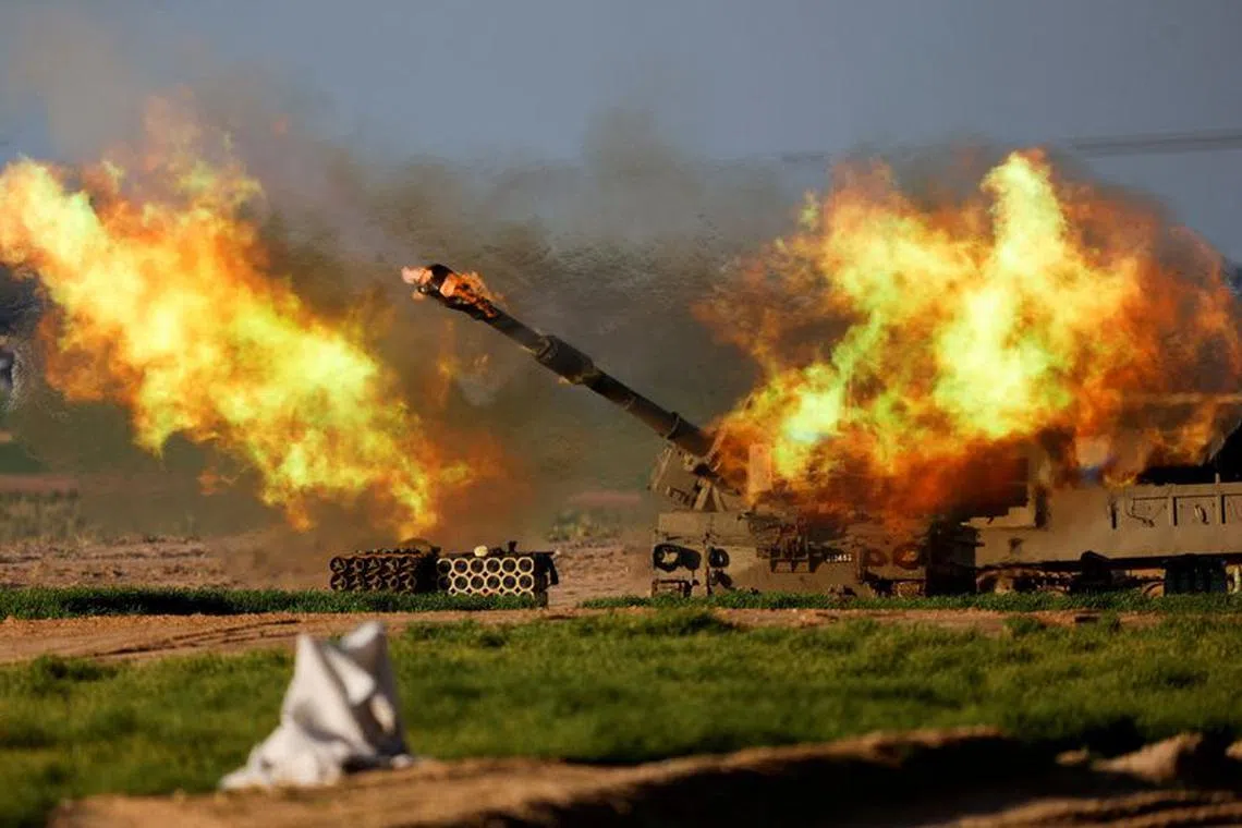 An Israeli mobile artillery unit fires towards Gaza, amid the ongoing conflict between Israel and the Palestinian Islamist group Hamas, near the Israel-Gaza border, in Israel, January 31, 2024. REUTERS/Amir Cohen/File Photo