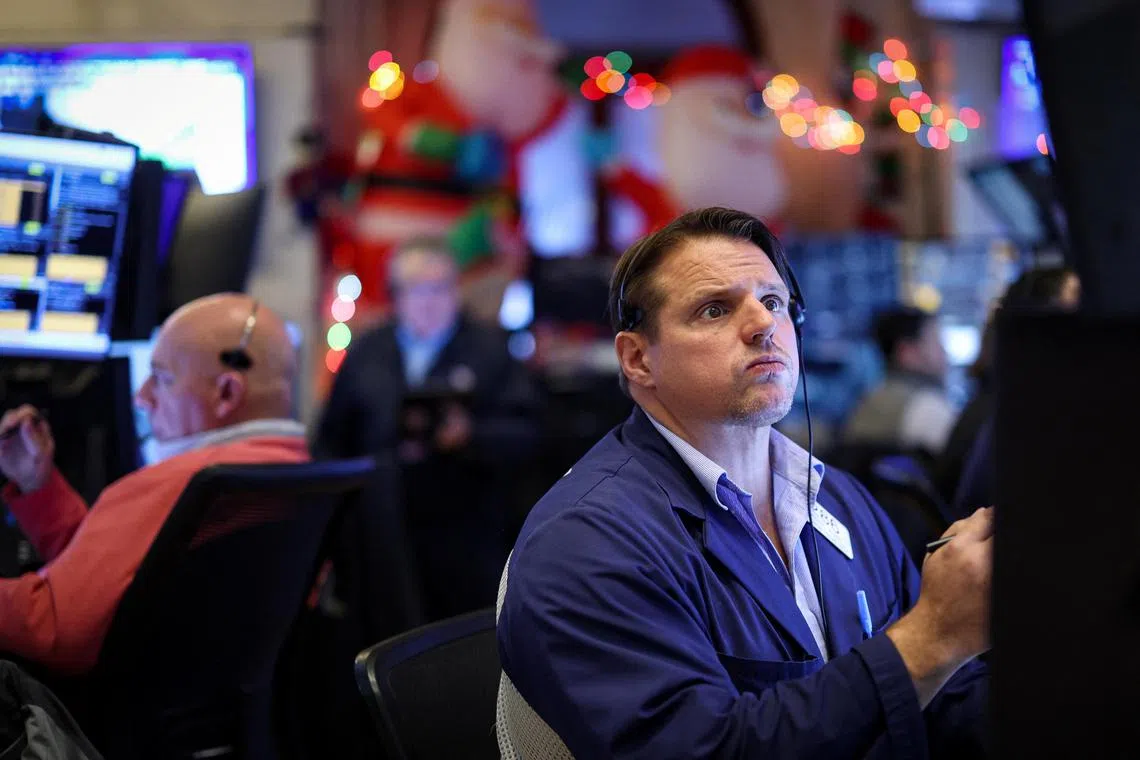 Traders working on the floor of the New York Stock Exchange, in New York City, on Dec 10.