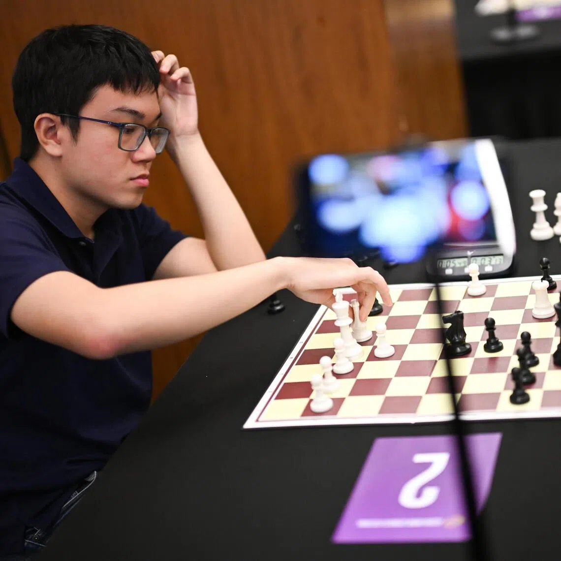 Singaporean Grandmaster Tin Jingyao (left) playing chess with Yan Tianqi from China at the inaugural Asian Mind Sports Festival at Suntec Singapore Convention & Exhibition Centre on Nov 13, 2025.