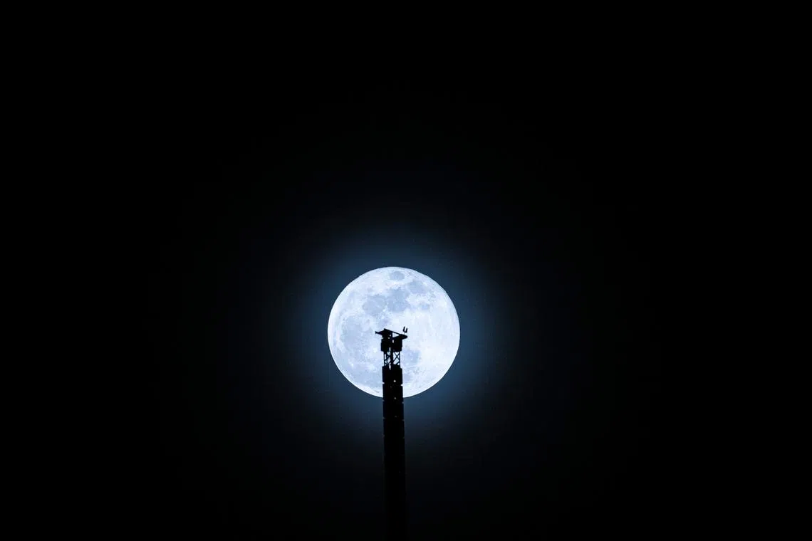 The Harvest Moon rising behind the Bukit Batok Transmission Tower on September 18, 2024.