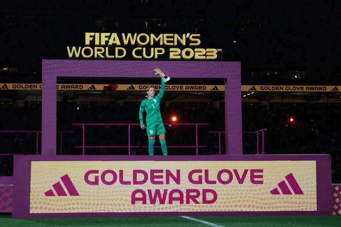 FILE PHOTO: Soccer Football - FIFA Women's World Cup Australia and New Zealand 2023 - Final - Spain v England - Stadium Australia, Sydney, Australia - August 20, 2023  England's Mary Earps celebrates with the golden gloves award REUTERS/Hannah Mckay/File Photo