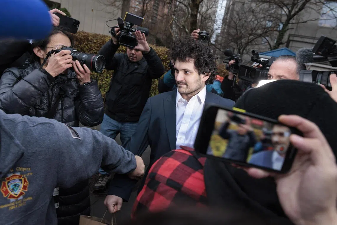 FTX founder Sam Bankman-Fried is led out of a US federal courthouse  in New York after being released on bail on Dec 22, 2022.