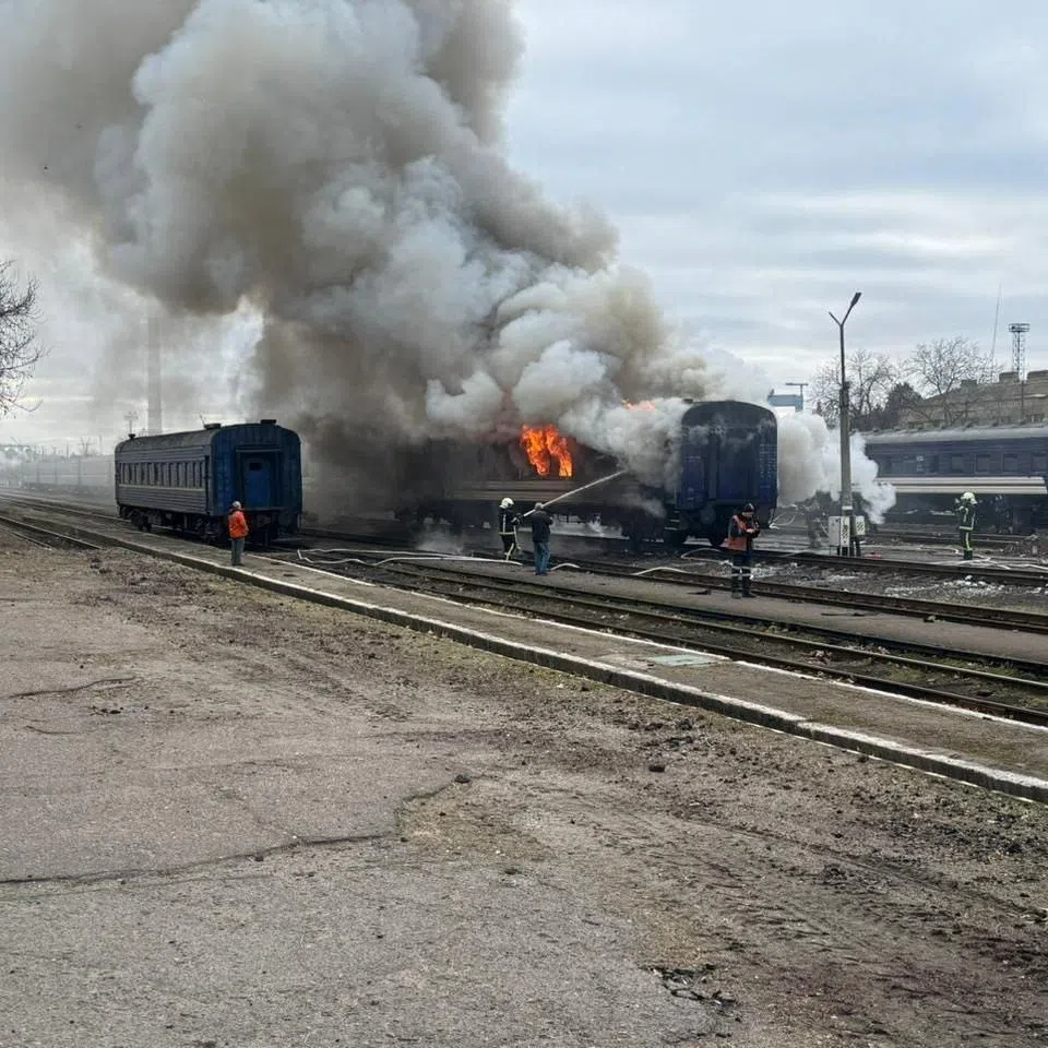 Firefighters extinguish a passenger train after it was hit by a Russian drone strike, amid Russia's attack on Ukraine, at a railway station in Mykolaiv region, Ukraine March 4, 2026.  Deputy Prime Minister for Restoration of Ukraine - Minister for Communities and Territories Development Oleksii Kuleba via Facebook/Handout via REUTERS