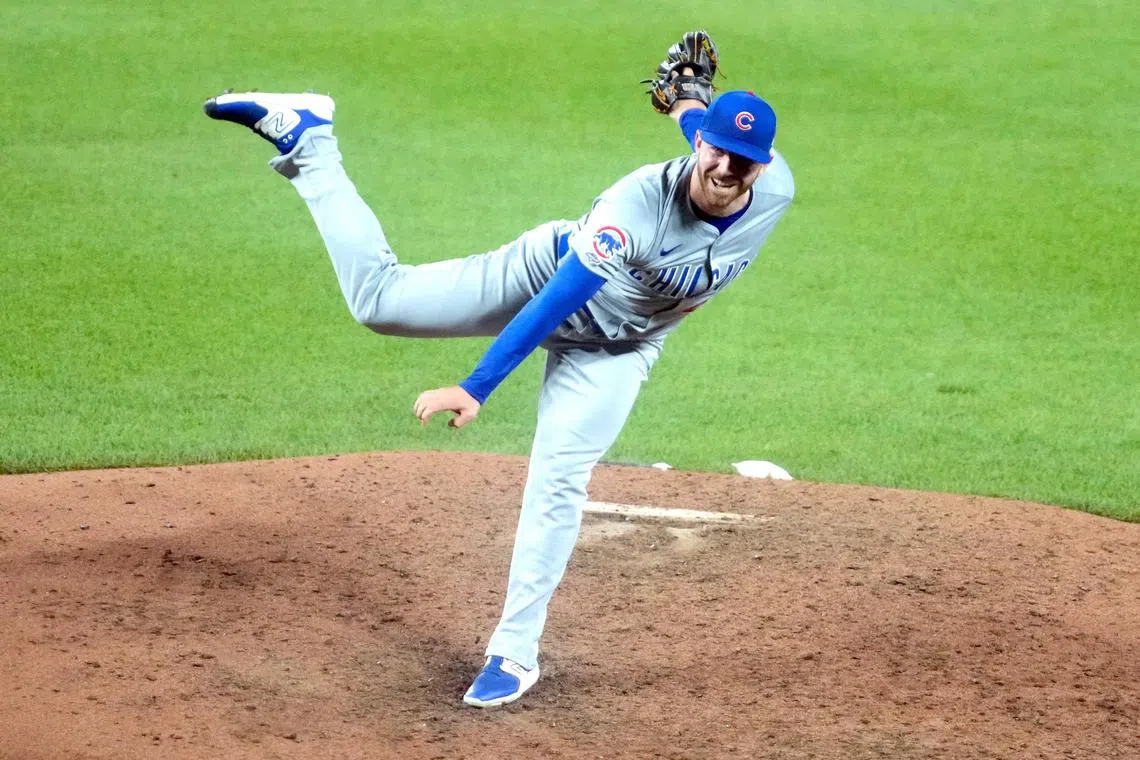 Hunter Bigge of the Chicago Cubs pitching in his Major League Baseball debut in the ninth inning against the Baltimore Orioles on July 9.