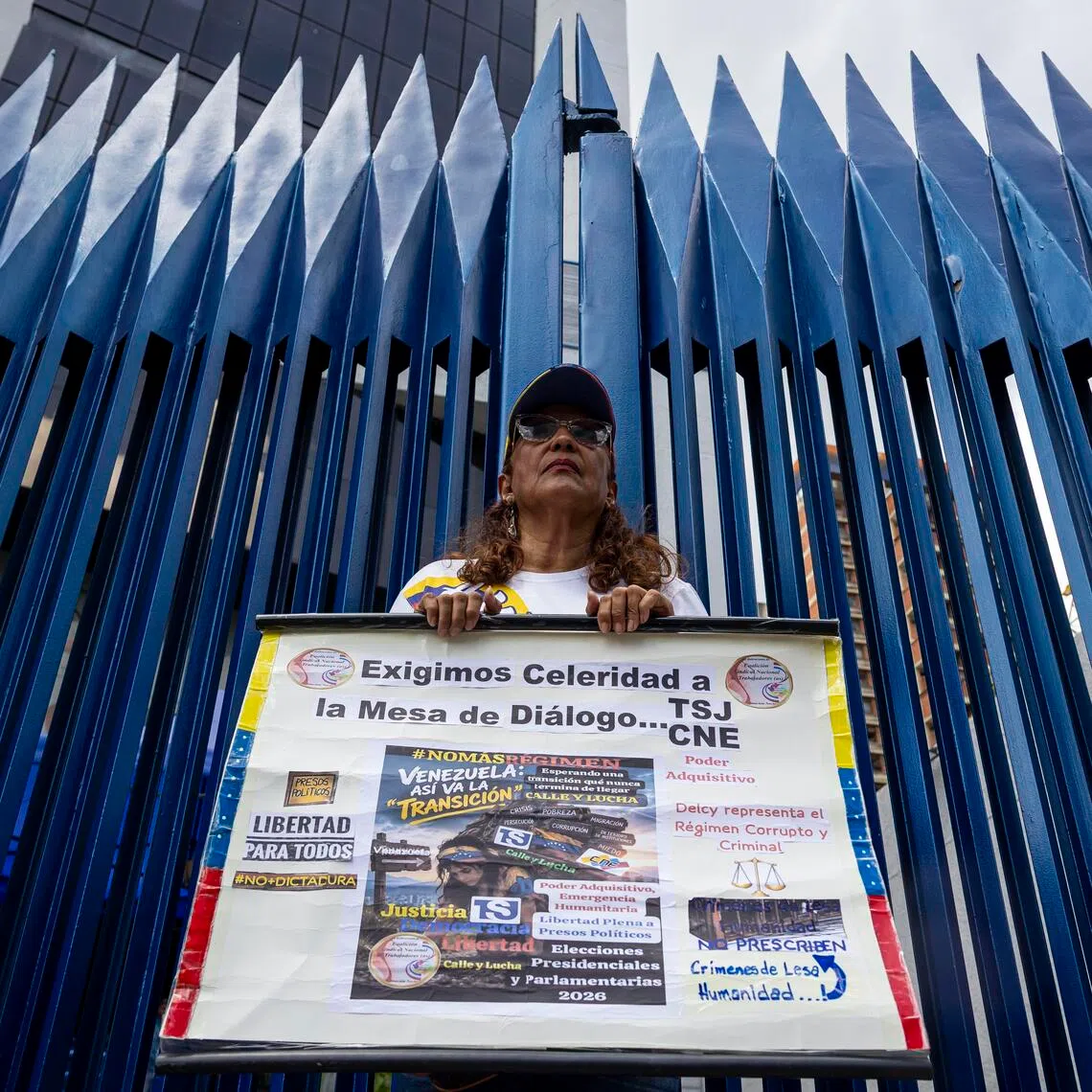 A protester calling for an election schedule and the return of leader and Venezuelan opposition leader Maria Corina Machado in Caracas, on Sept 28.