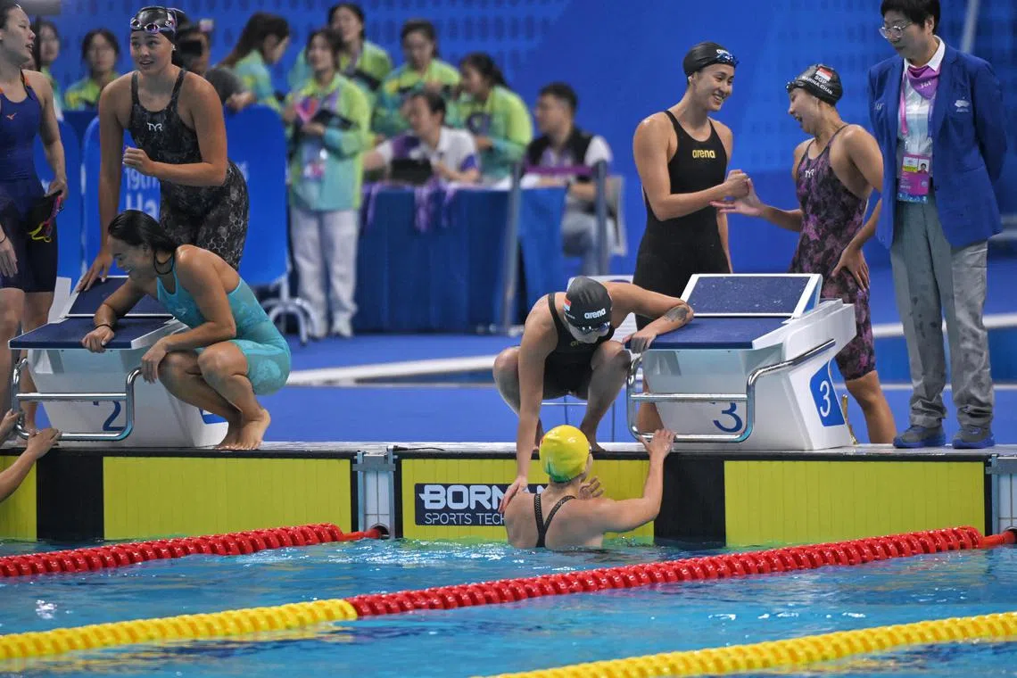 The Singapore Women's 4 x 100m Freestyle Relay team (right) pictured after the final at the Hangzhou Olympic Sports Centre Aquatic Sports Arena on Sept 24, 2023.