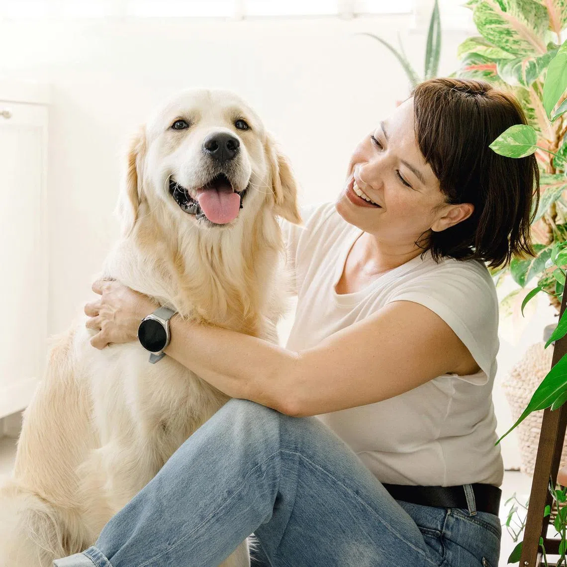 Kiss92 FM’s Angelique Teo and her  two year old golden retriever, Tofu.