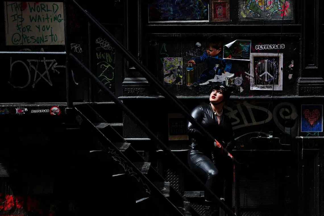 Social media influencer, Jeanne Luster shooting her TikTok video "The Actor Bat", in an alley way in the Lower Manhattan area of New York City, U.S., on April 4, 2024. 