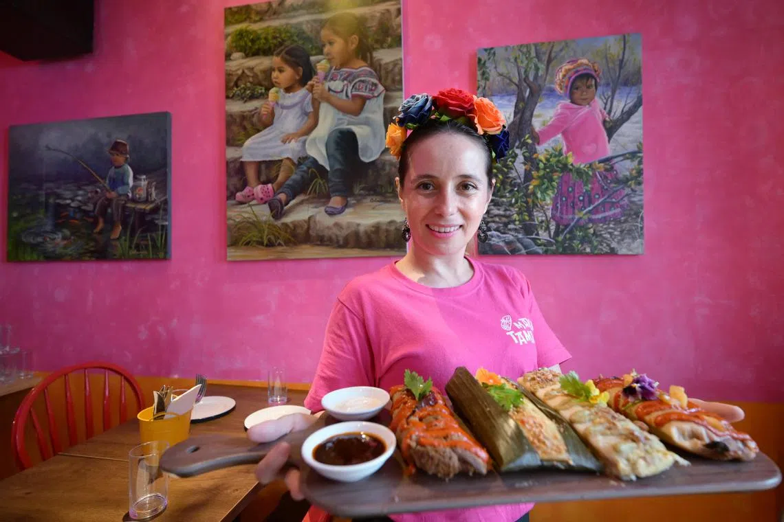 Chef Maribel Colmenares, 38, the co-founder of Mexican restaurant Mami's Tamales, with the Mami’s Tamales Platter comprising Chicken Tinga, “Moo Ping” Pork, Ayam Sambal Hijau and Mushroom Pastor (left to right).