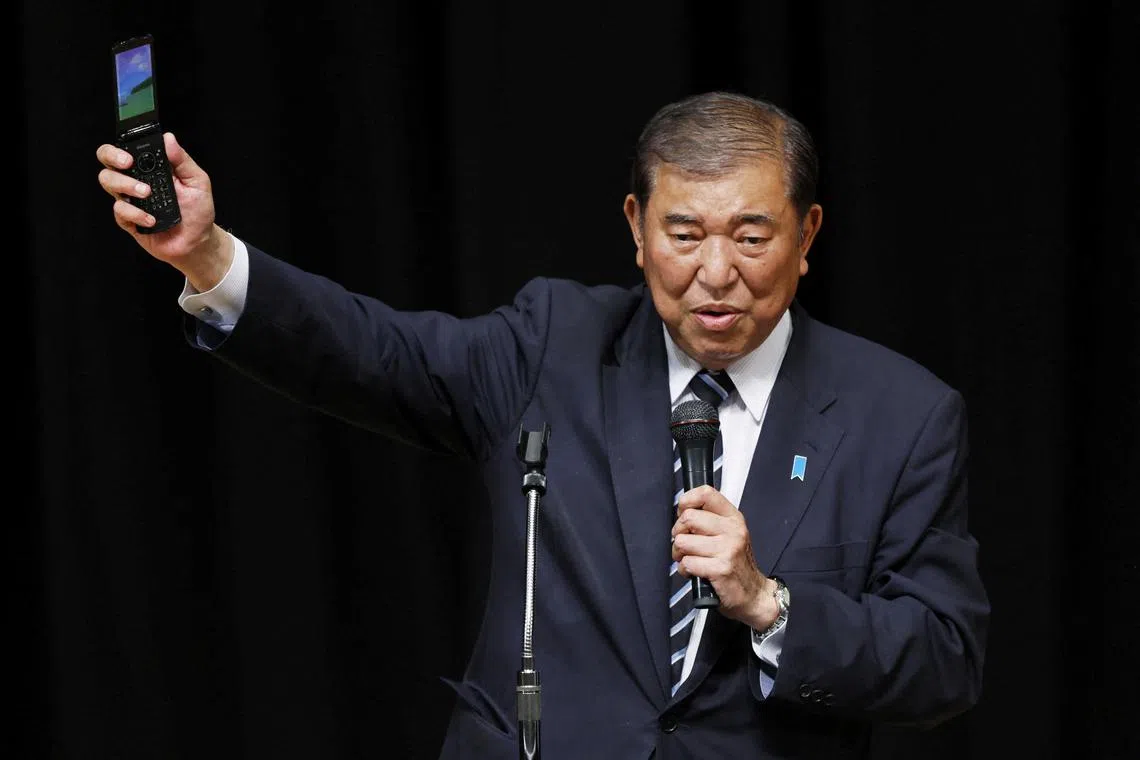 Japanese Prime Minister Shigeru Ishiba makes a speech at a campaign for the upcoming general election in Toyonaka, Osaka Prefecture, Japan, October 24, 2024, in this photo taken by Kyodo. Mandatory credit Kyodo/via REUTERS