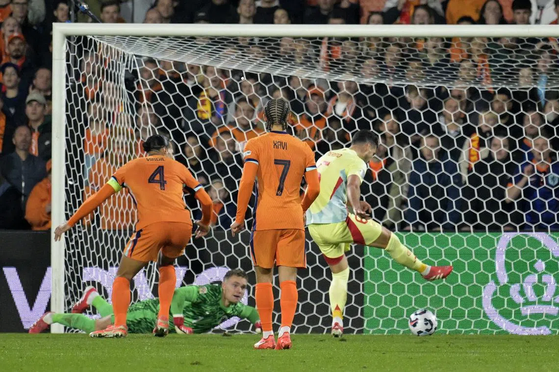 Soccer Football - Nations League - Quarter Final - First Leg - Netherlands v Spain - Feyenoord Stadium, Rotterdam, Netherlands - March 20, 2025 Spain's Mikel Merino scores their second goal REUTERS/Fabian Bimmer