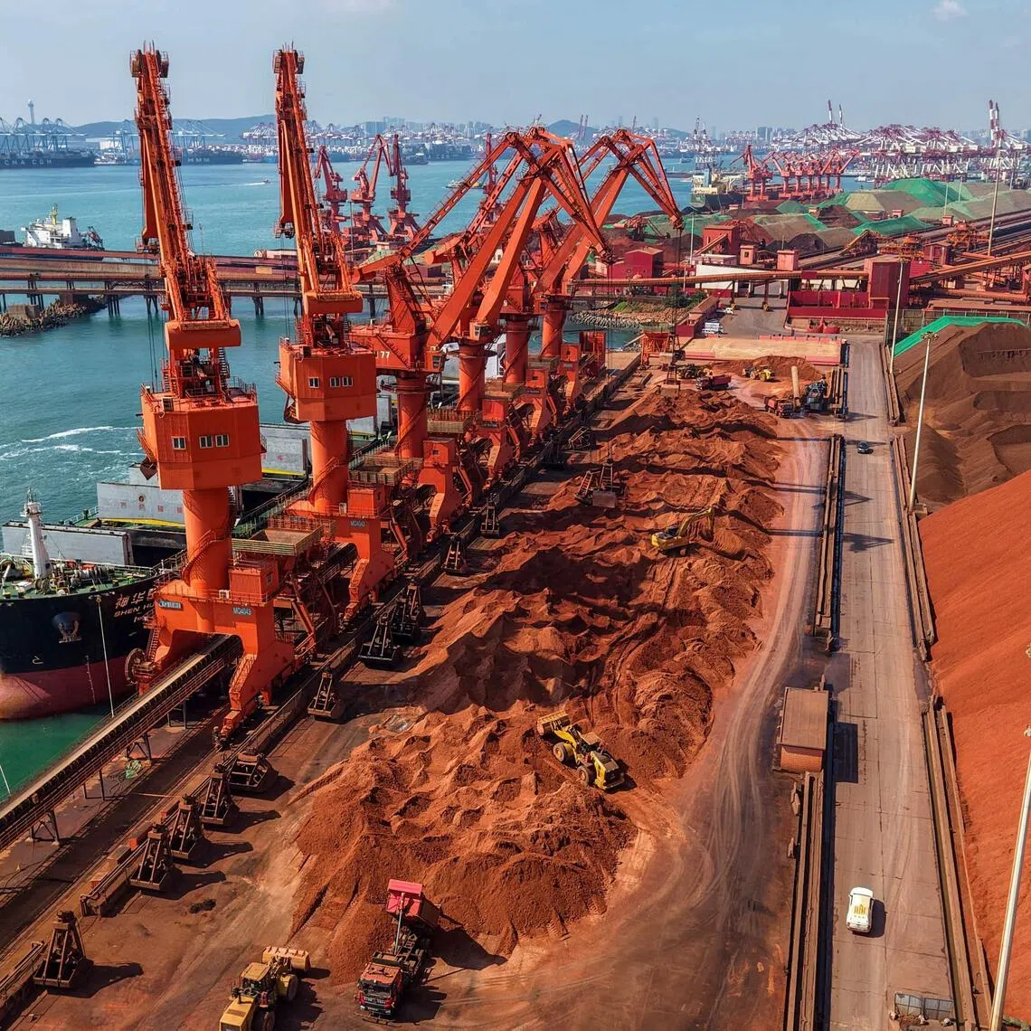 A cargo ship unloading imported iron ore at a port in Qingdao, China on July 30. Radiant World’s website says it is one of the world’s biggest iron ore traders.