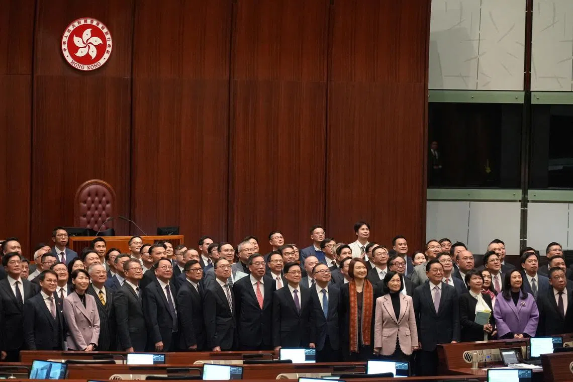 Hong Kong Chief Executive John Lee, government officials and lawmakers pose for a group photo, after the Safeguarding National Security Bill, also referred to as Basic Law Article 23, was passed at the Hong Kong’s Legislative Council, in Hong Kong, China March 19, 2024. REUTERS/Joyce Zhou