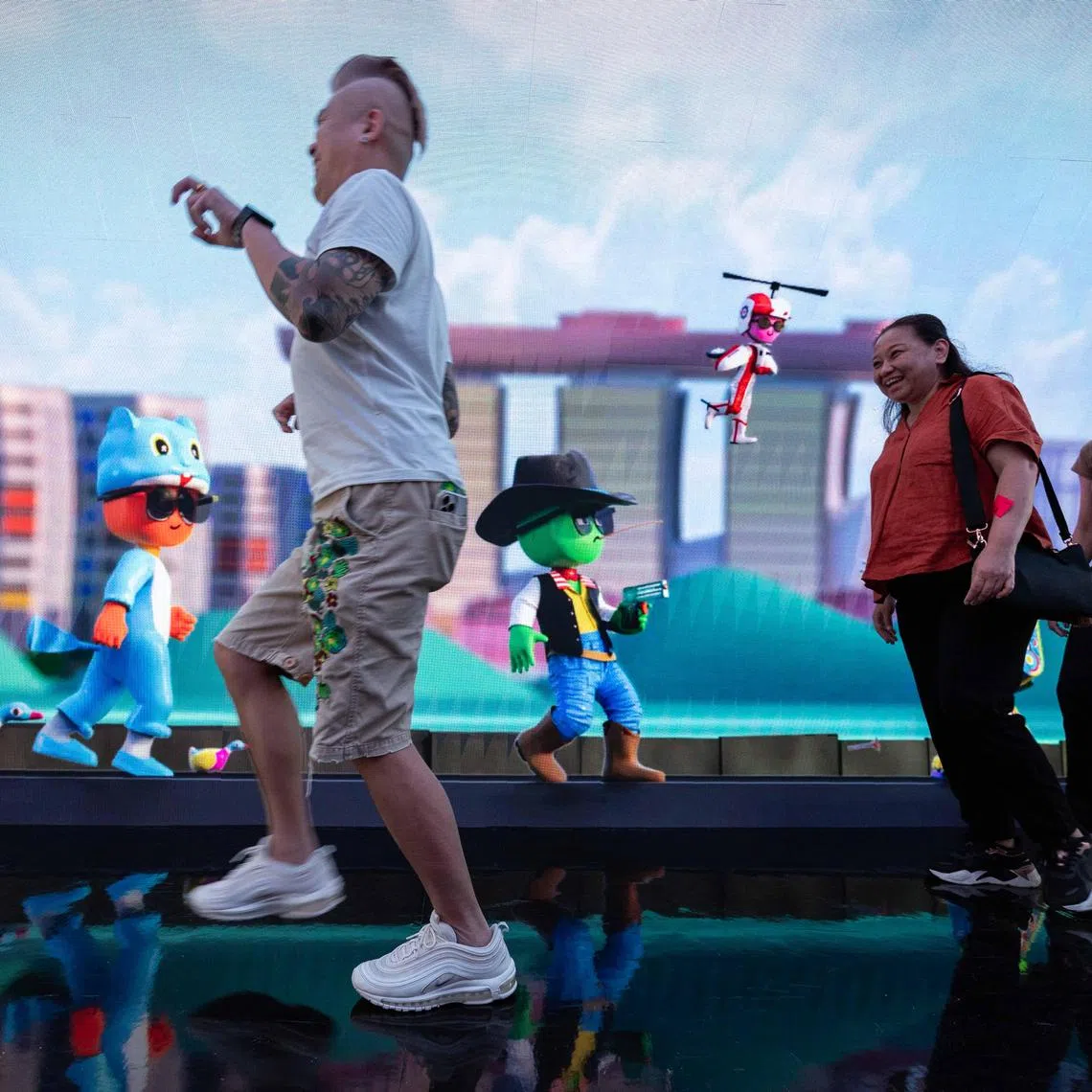 A member of the public poses in the tunnel with Gman.