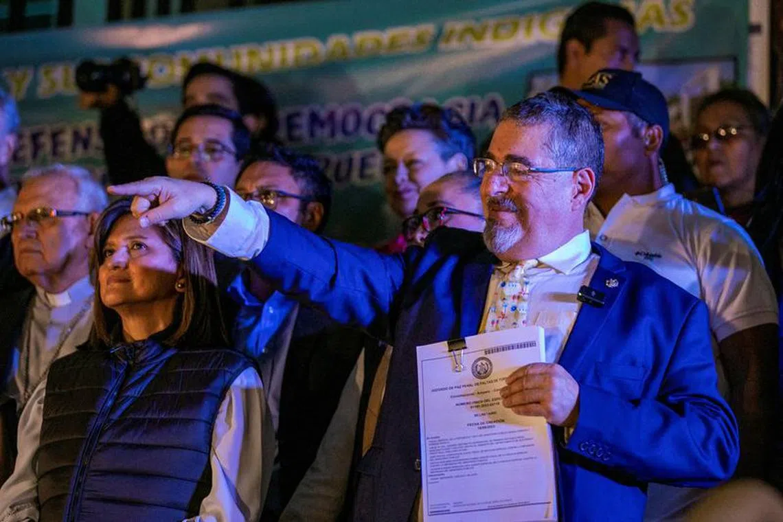 FILE PHOTO: Guatemalan President-elect Bernardo Arevalo gestures on the day he delivers a speech to supporters during a protest outside the Supreme Court of Justice (CSJ), after he temporarily suspended his participation in the government transition following a raid on electoral facilities by the top prosecutor's office, in Guatemala City, Guatemala September 18, 2023. REUTERS/Luis Echeverria/File Photo