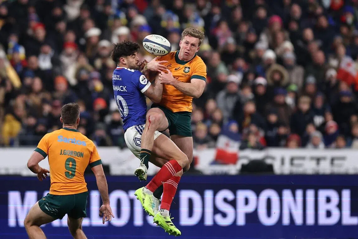 France fly-half Romain Ntamack  and Australia wing Harry Potter contesting a high ball during Les Bleus' 48-33 win in the Autumn Nations Series international rugby union Test at the Stade de France  on Nov 22, 2025.