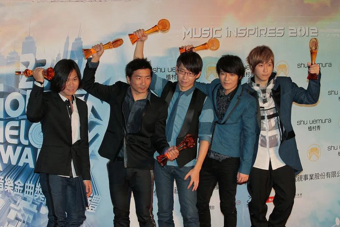 FILE PHOTO: Taiwan pop band Mayday pose after winning the Best Song of The Year, the Best Album Composer, the Best Arranger, the Best Composer, the Best Mandarin Album of the Year and the Best Musical group categories at the 23rd Golden Melody Awards in Taipei June 23, 2012. REUTERS/Yi-ting Chung/File Photo