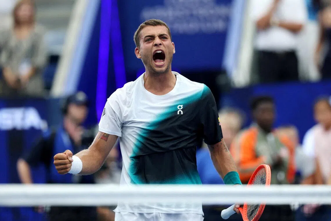 Flavio Cobolli celebrates after winning his match against Francisco Comesana.