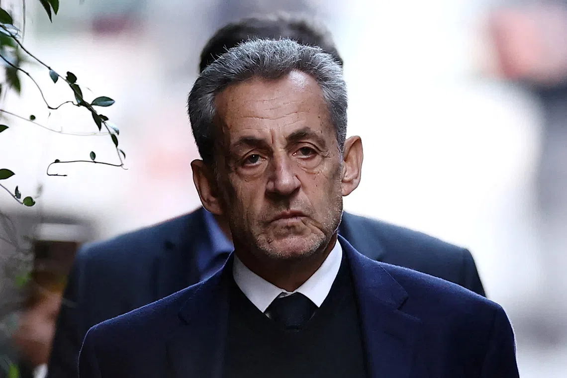 FILE PHOTO: Former French president Nicolas Sarkozy leaves his house on the day of his incarceration at the Sante prison to begin his five-year prison sentence for criminal conspiracy over attempts to raise campaign funds from Libya, in Paris, France, October 21, 2025. REUTERS/Sarah Meyssonnier/File Photo