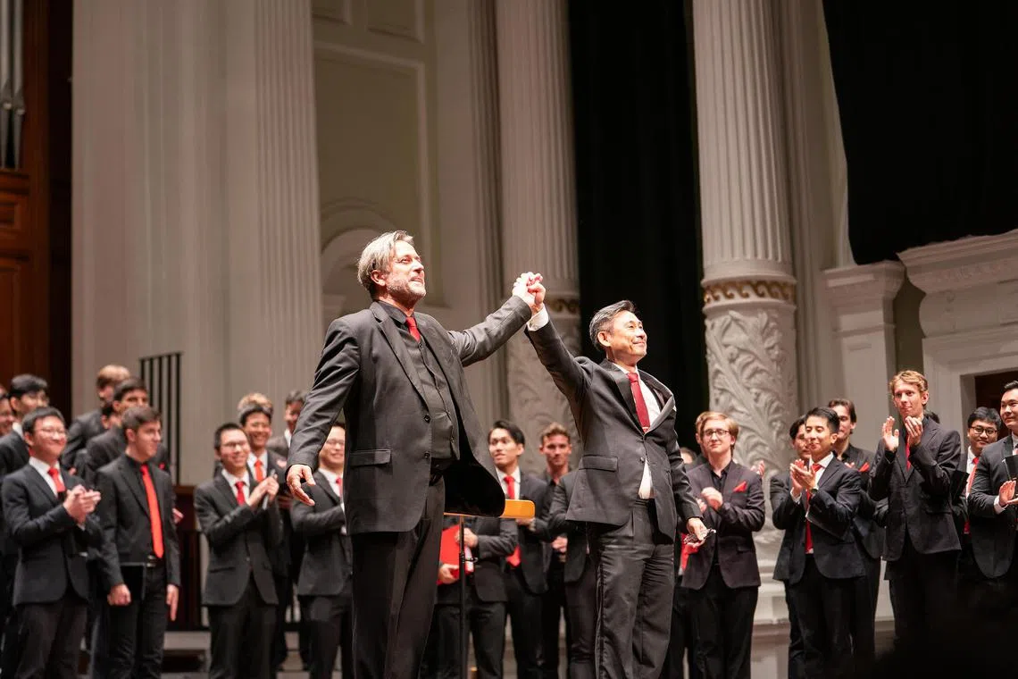 Choral directors Toh Ban Sheng (front right) and Ambroz Copi (front left) taking a bow after the concert. 



Credit copyright: Hagen Indra