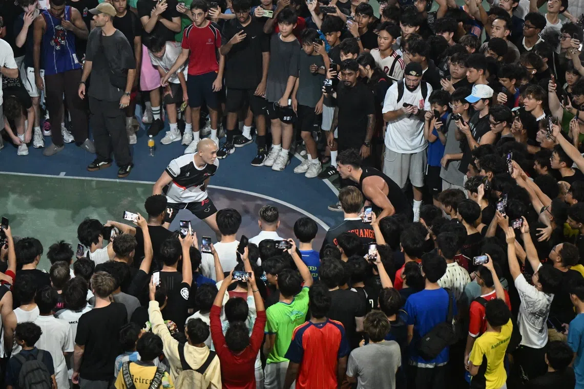 Canadian basketball influencer Matt Kiatipis (right) at a basketball court at 6 Lorong Lew Lian on Oct 7.