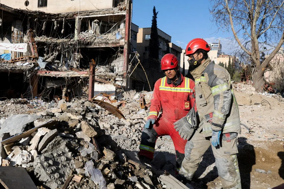 Members of a Red Crescent rescue team work at a building that was damaged by a strike, amid the U.S.-Israeli conflict with Iran, in Tehran, Iran, March 21, 2026. Reuters/Alaa Al-Marjani