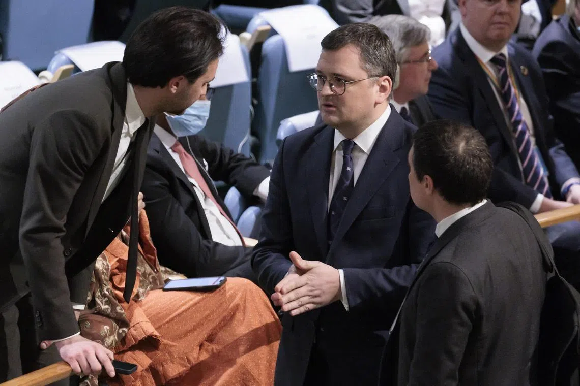 Ukraine's Foreign Minister Dmytro Kuleba (centre) after speaking on the conflict in Ukraine at the UN, on Feb 22, 2023.