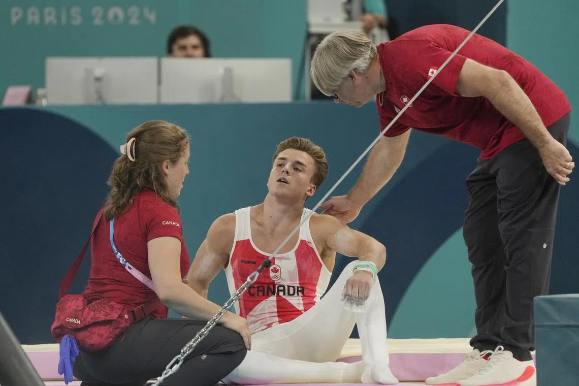 Gymnastics-Canada's Dolci gets second chance on bar after equipment ...