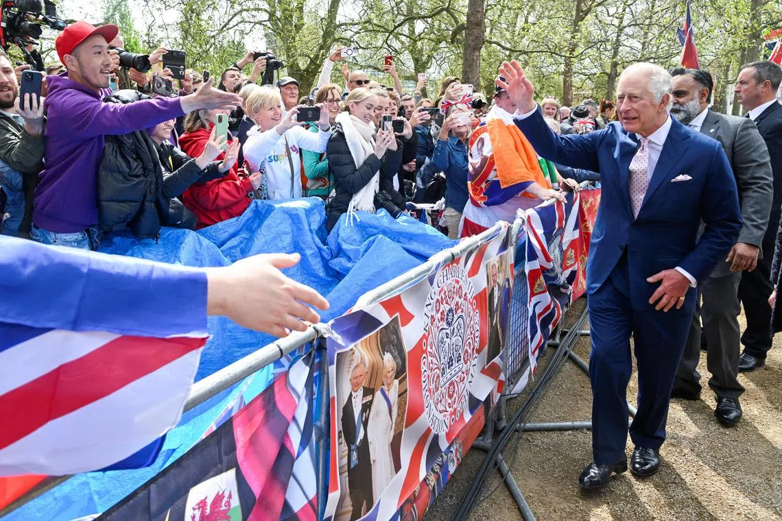 Britain's King Charles meets well-wishers during a walkabout on the Mall outside Buckingham Palace ahead of his and Camilla, Queen Consort's coronation, in London.