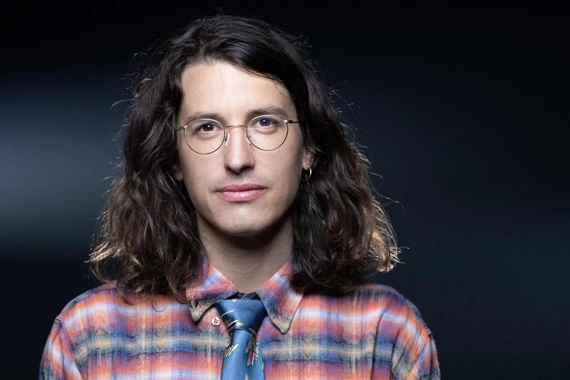 (FILES) In this file photo taken on August 30, 2021, French comics' author Bastien Vives poses during a photo session in Paris. - The comic world was shook by a controversy on the place accorded to Vives in an exhibition planned by the 2023 Angouleme Comic Festival, as the illustrator is accused of promoting incest and pedo-criminality through some of his works. (Photo by JOEL SAGET / AFP)