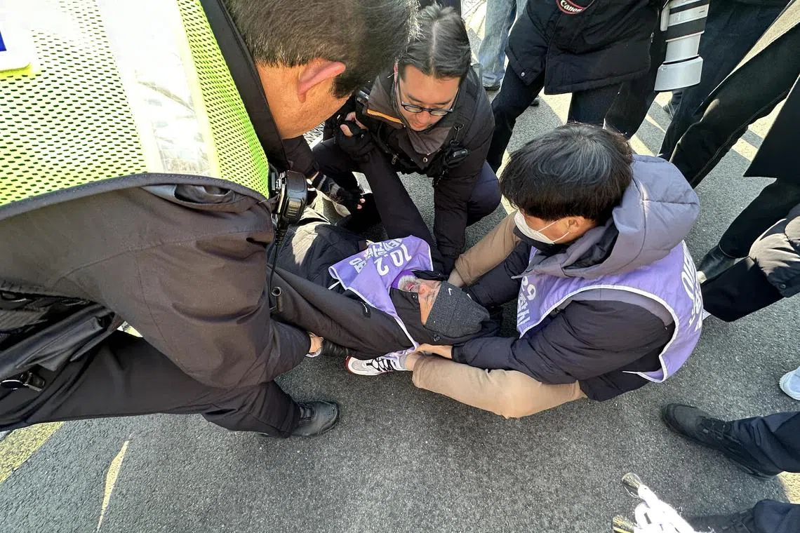 wtveto - Mr Lee Jung-min, Chairman of the Association of Families of Itaewon Disaster Victims, collapsed in anger after the Cabinet_s decision to reject a bill for a special investigation into the Itaewon crowd crush of Oct 2022

Credit: Straits Times/Wendy Teo