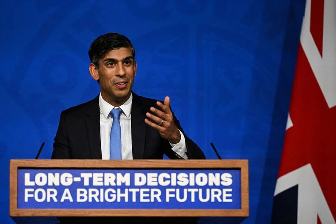 FILE PHOTO: Britain's Prime Minister Rishi Sunak delivers a speech during a press conference on the net zero target, at the Downing Street Briefing Room, in central London, on September 20, 2023. The UK looked set to backtrack on policies aimed at achieving net zero emissions by 2050 with Prime Minister Rishi Sunak expected to water down some of the government's green commitments. The move comes amid growing concern over the potential financial cost of the government's policies to achieve net zero carbon emissions by mid-century.     JUSTIN TALLIS/Pool via REUTERS/File photo