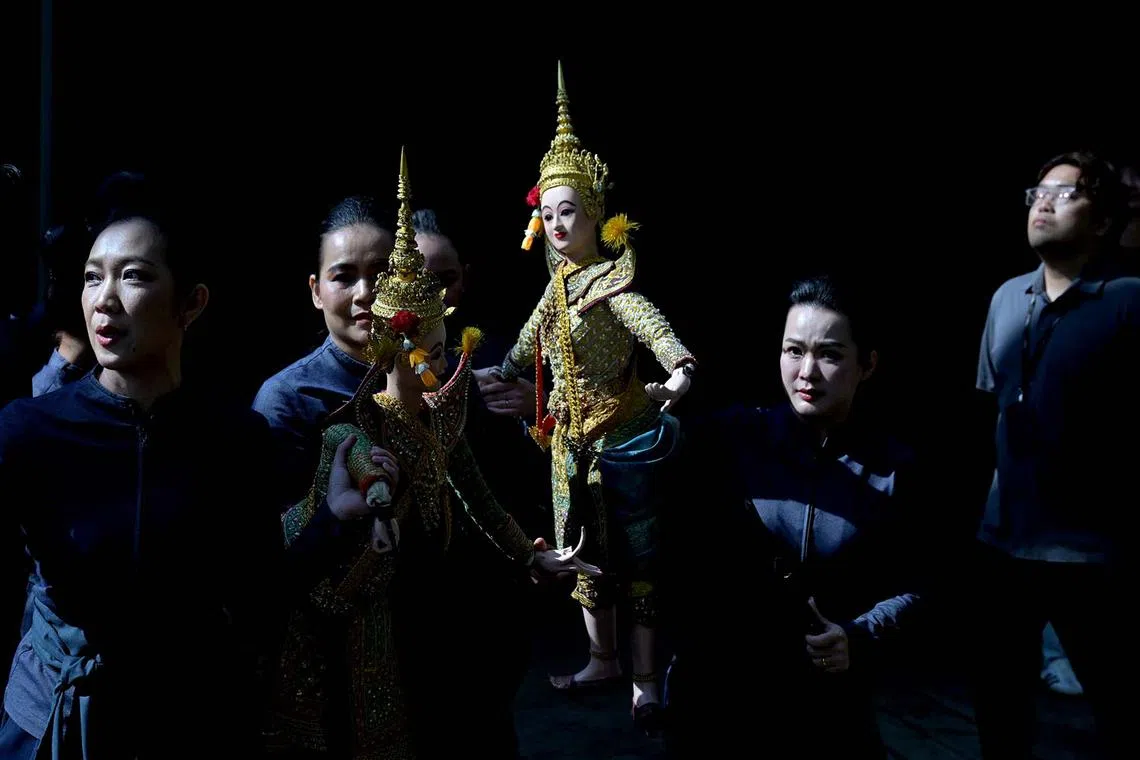 Traditional Thai puppet performancers from the Aksra Hoon Lakorn Lek troupe getting ready for their performance during the launch of the Orchids from the Land of Smiles floral display at Singapore's Cloud Forest on Feb 14, 2025. More than 60 taxa of stunning orchids, including those from Thailand or with origins that can be traced to Thai species, are showcased in the new display.