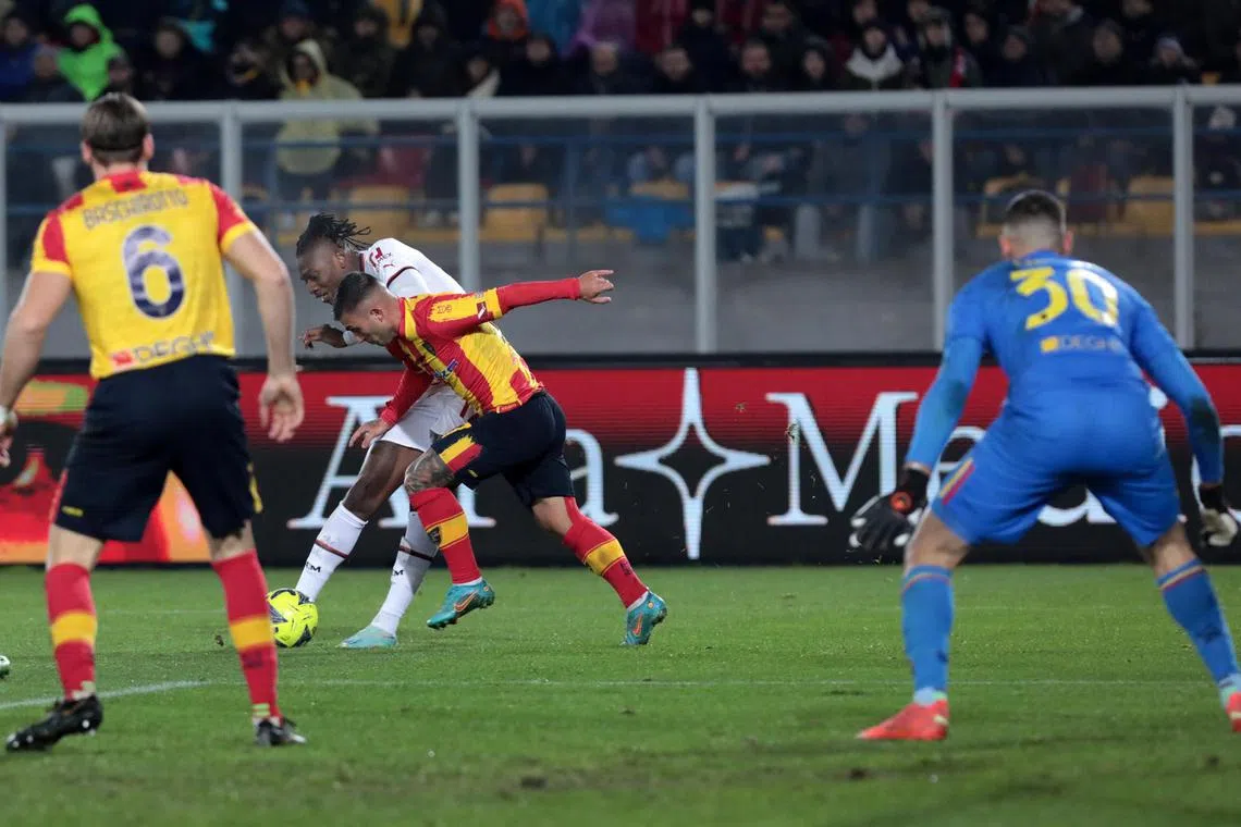 Milan's Rafael Leao scores the 2-1 goal.