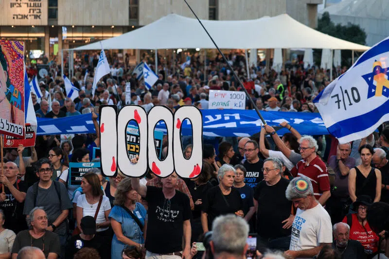 Israelis hold a ceremony to mark 1000 days since the deadly October 7, 2023, Hamas-led attack from Gaza, in a public square which came to be known as 'hostage square' in Tel Aviv, Israel, July 2, 2026. REUTERS/Ronen Zvulun