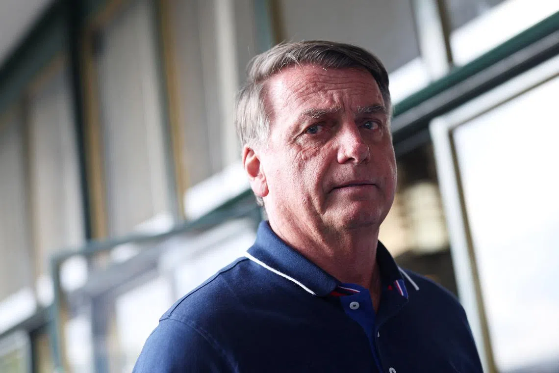 FILE PHOTO: Former Brazilian President Jair Bolsonaro walks outside Congonhas airport as he arrives in Sao Paulo, Brazil, March 24, 2025. REUTERS/Amanda Perobelli/File Photo