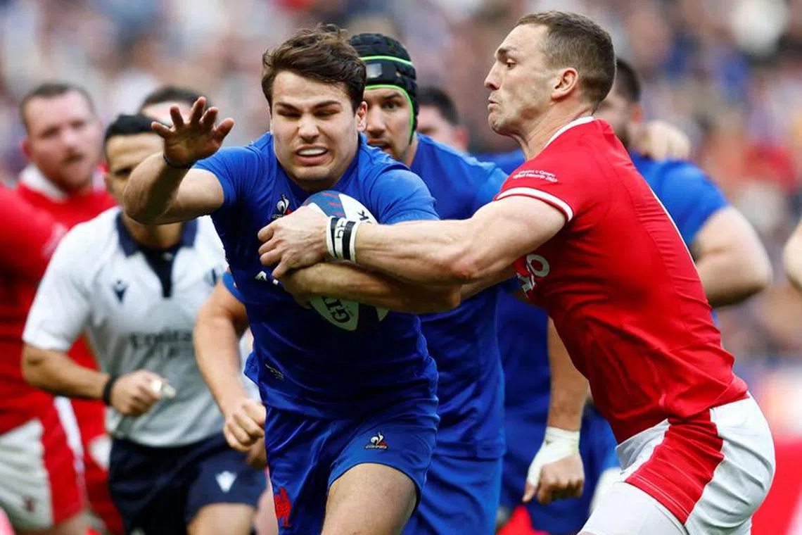 FILE PHOTO: Rugby Union - Six Nations Championship - France v Wales - Stade de France, Saint-Denis, France - March 18, 2023 France's Antoine Dupont in action with Wales' George North REUTERS/Gonzalo Fuentes/File Photo